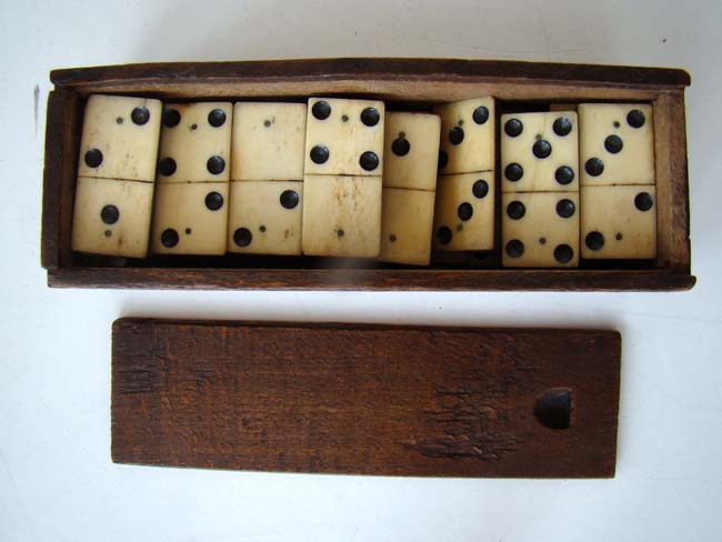 A cased set of bone and ebony Dominoes circa 1860-1880